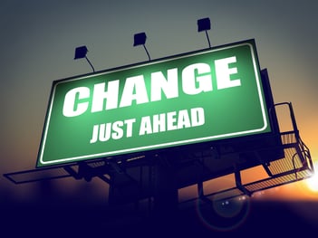 Change Just Ahead - Green Billboard on the Rising Sun Background